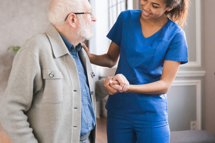 nurse-helps-out-an-elderly-gentleman